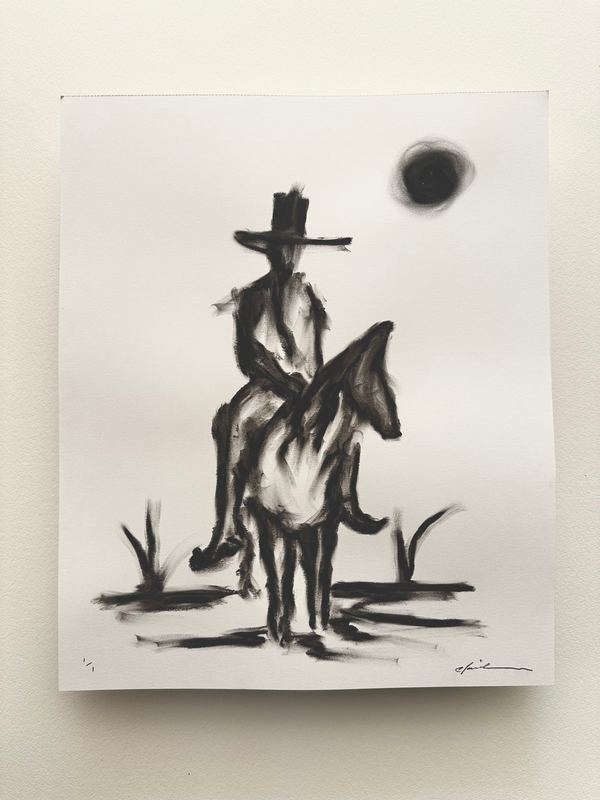 Black oil pastel drawing of a cowboy on horseback under a dark moon on white Bristol board