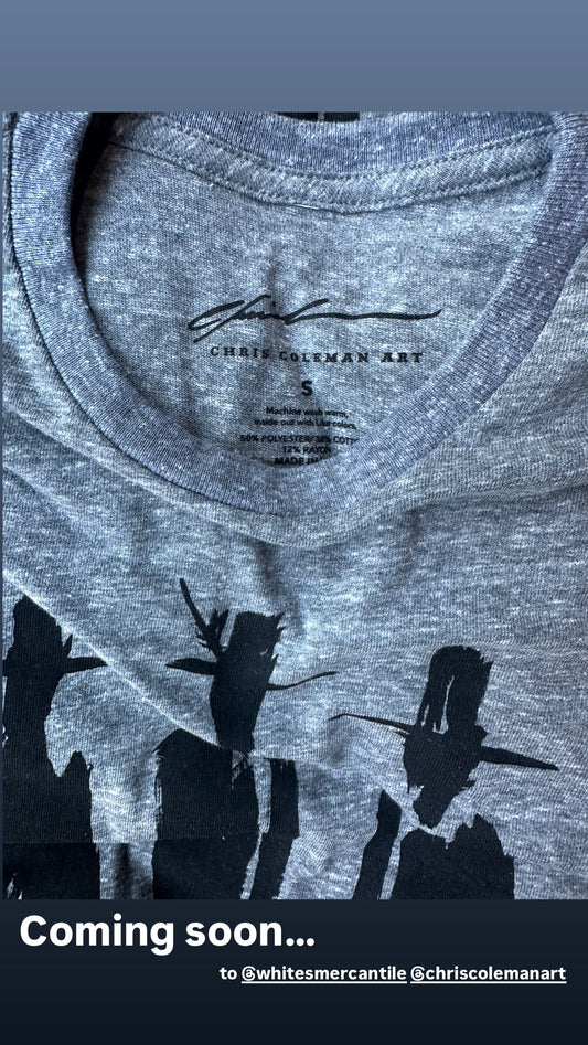 Close-up of the custom inner neck label on a grey T-shirt with a "Coming soon" caption