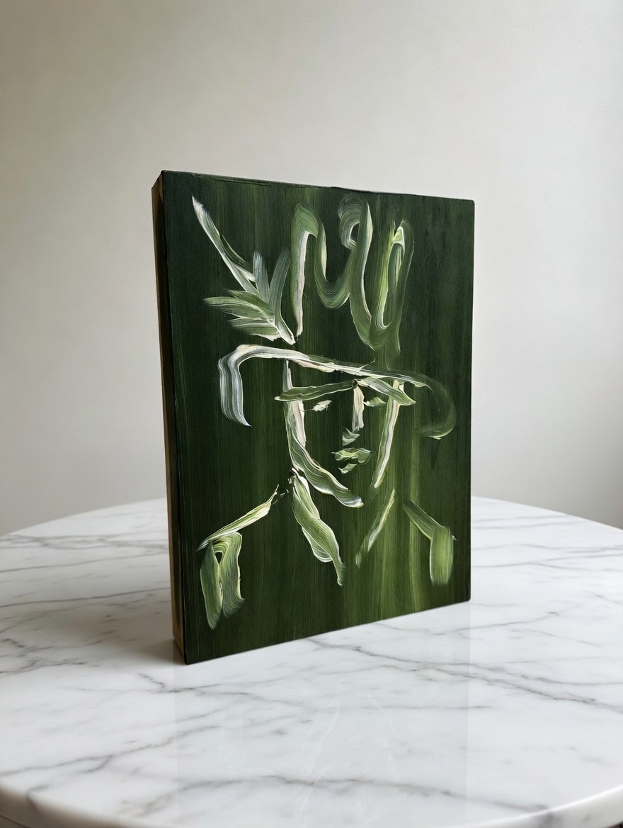 Jenkins green acrylic portrait of a cowboy on a wood panel, displayed on a marble table