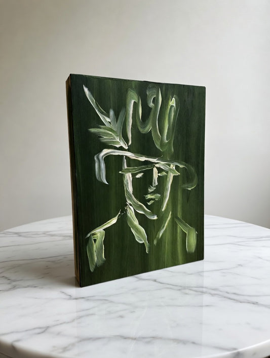 Jenkins green acrylic portrait of a cowboy on a wood panel, displayed on a marble table