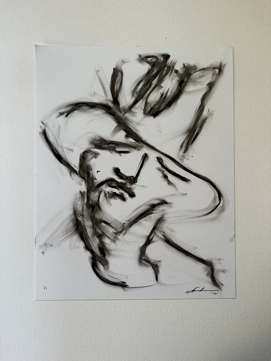 Black drawing of a young cowboy in a wide-brim hat on white paper