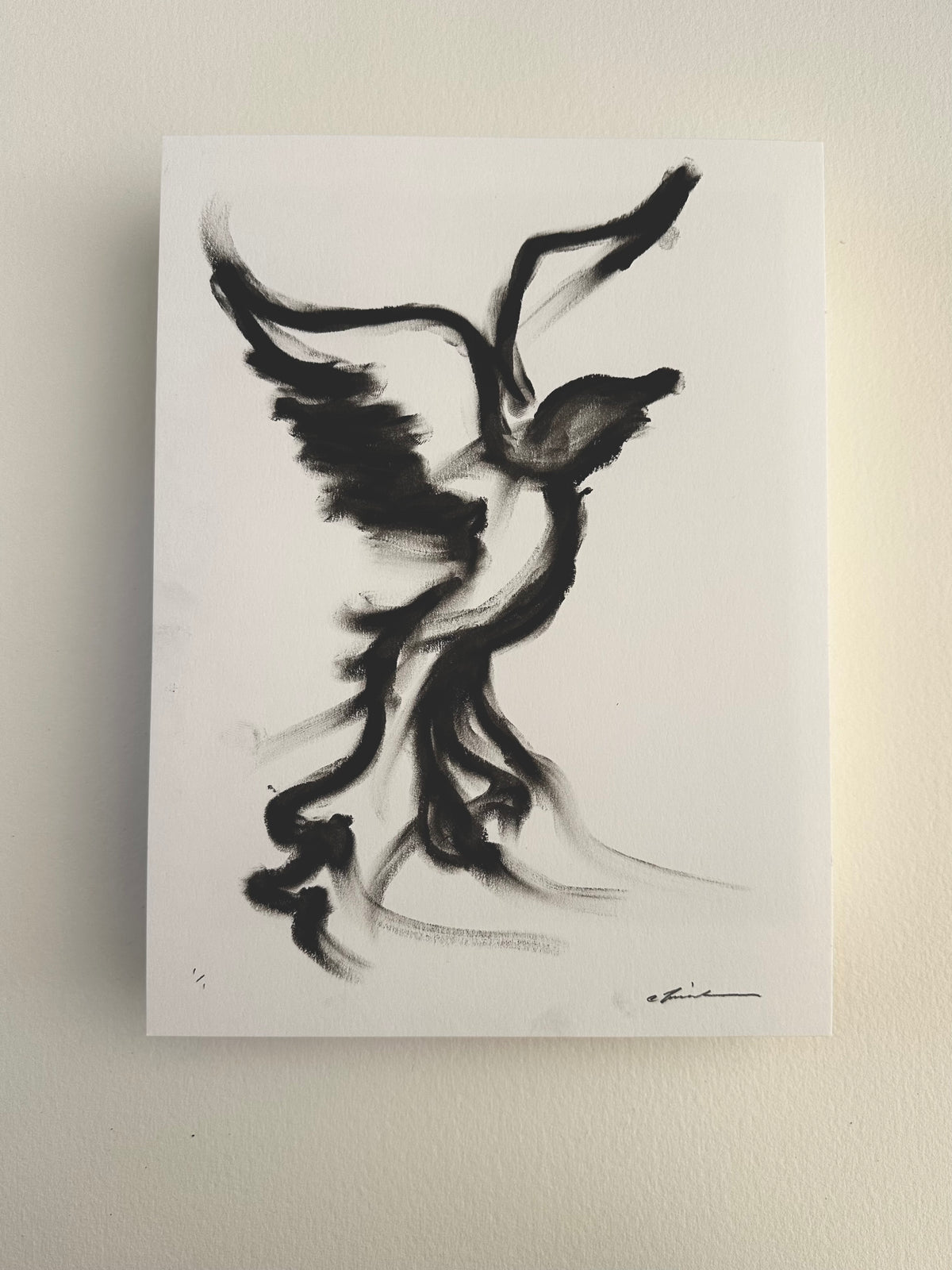 Black oil pastel drawing of a bird with outstretched wings taking flight on white Bristol board