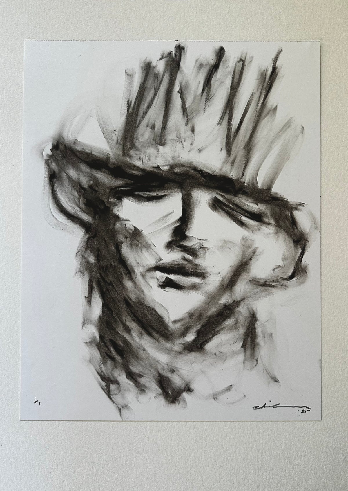 Black oil pastel portrait of a young cowboy in a hat on white Bristol board