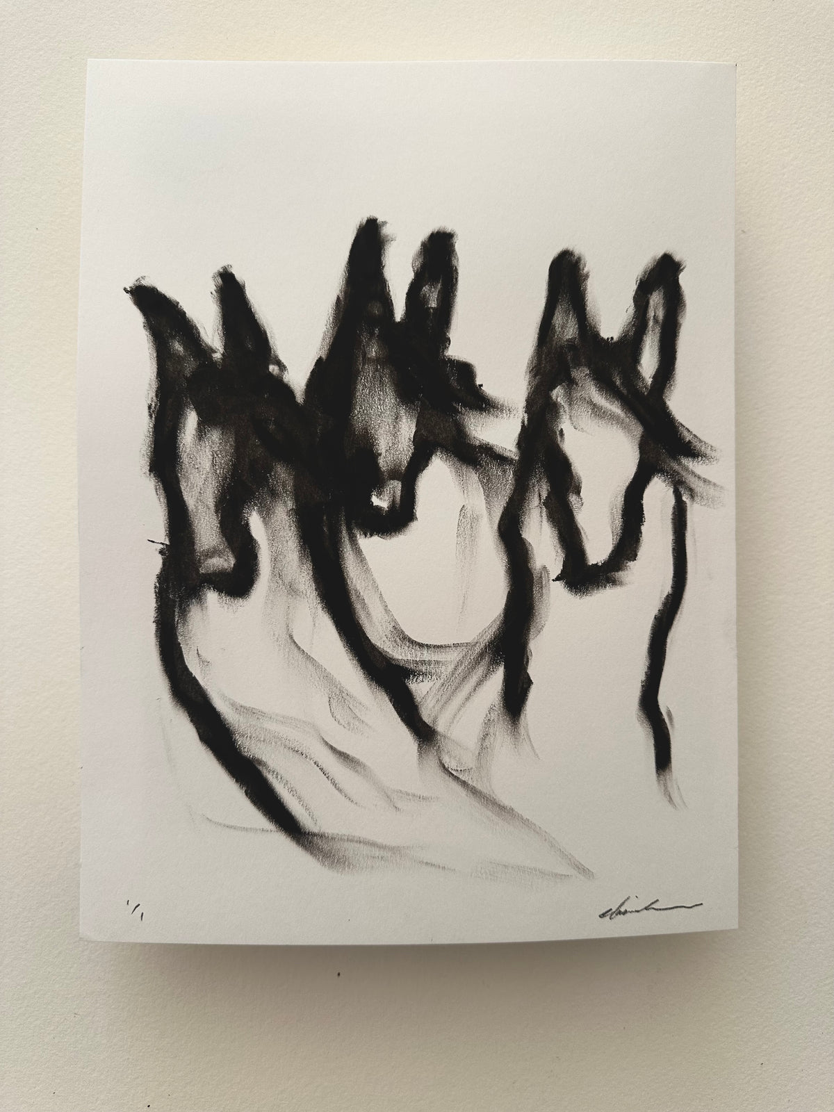 Black oil pastel drawing of three horse heads side by side on white Bristol board