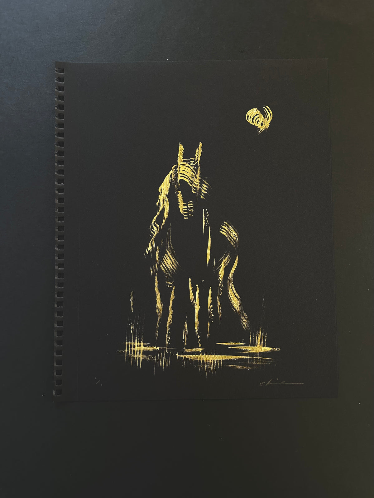 Gold acrylic painting of a horse beneath a moon on black paper