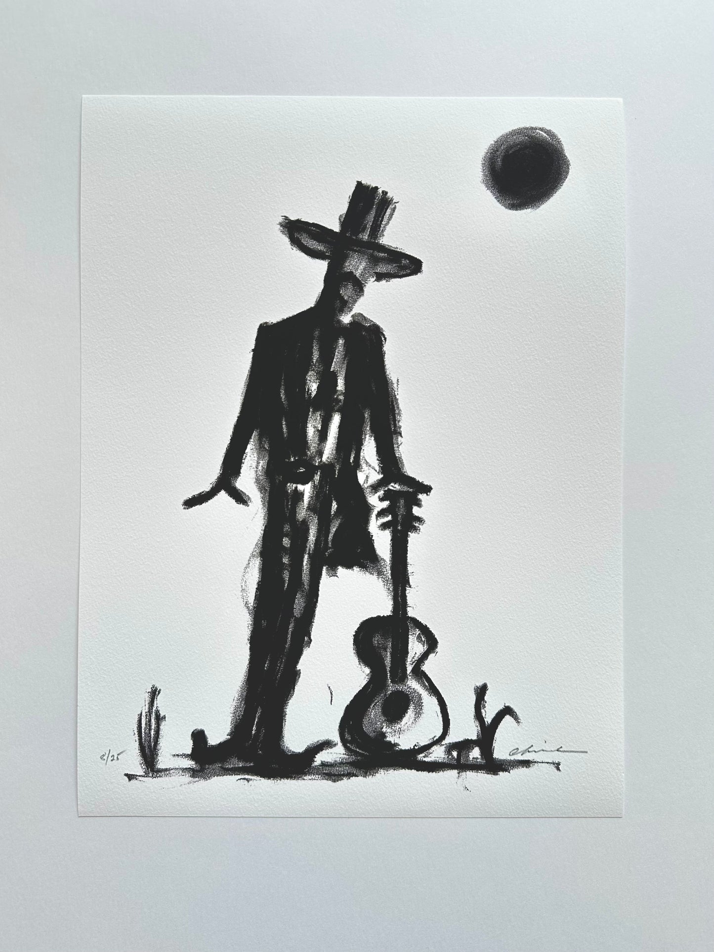Black ink artwork of a cowboy holding a guitar under a dark moon, giclée print on white paper