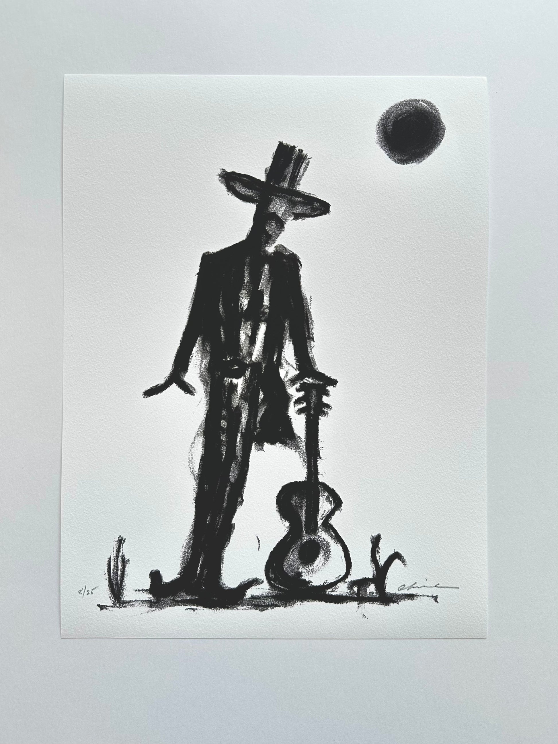 Black ink artwork of a cowboy holding a guitar under a dark moon, giclée print on white paper